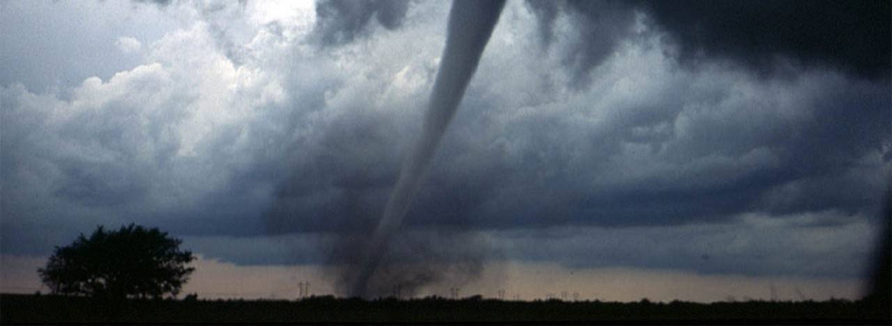 A tornado moving across open plains