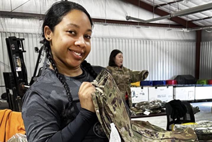 Before deployment, Aspyn Adams is getting fitted with her uniform and gear.