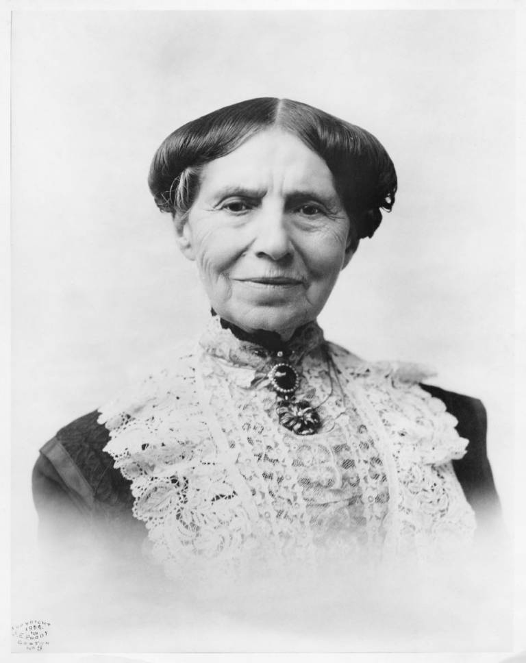 historical photo of woman in turn of the century dark dress