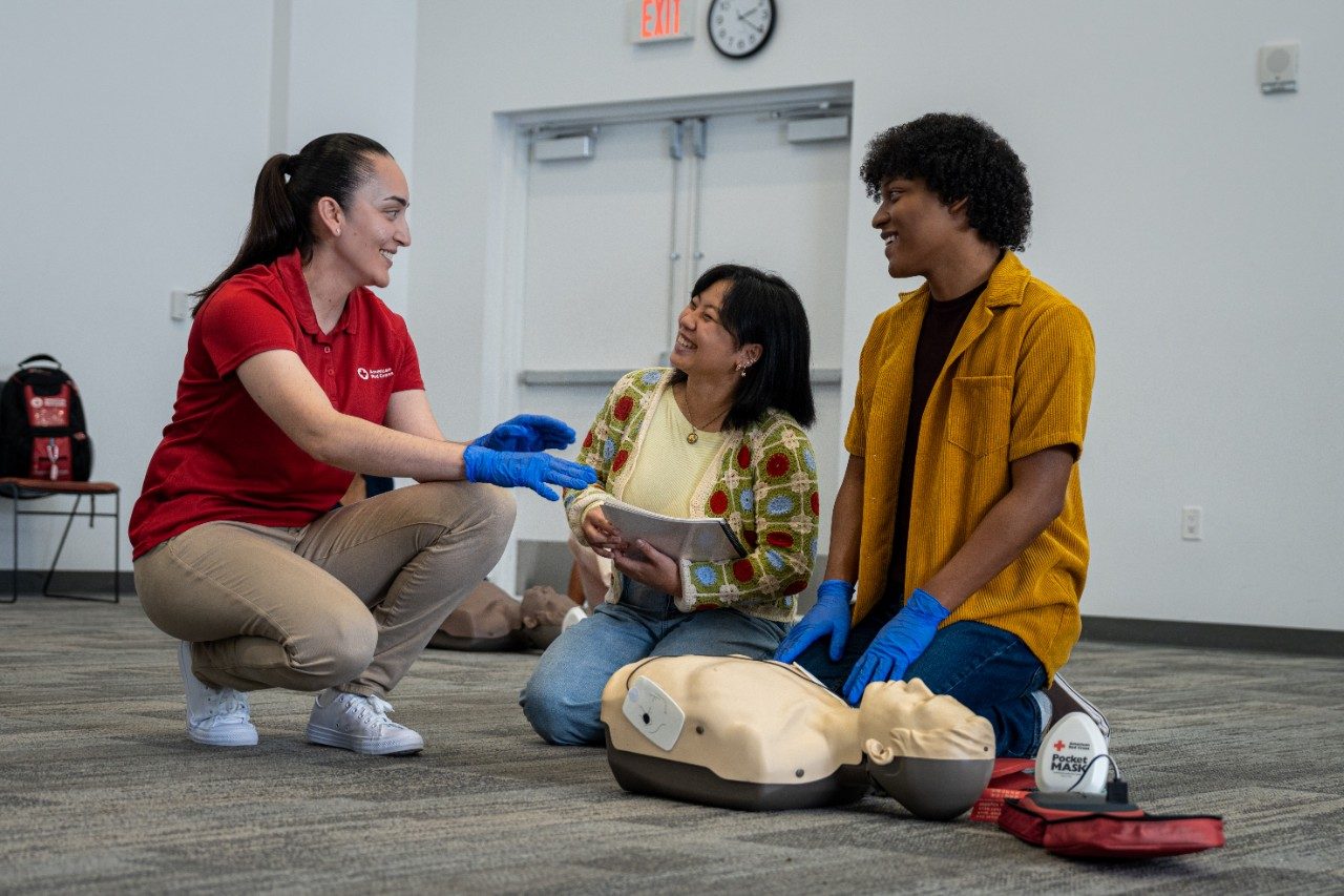 person performing CPR on a mannikin
