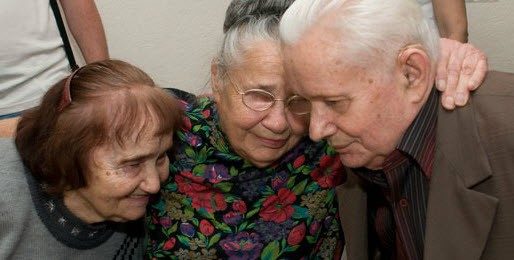 group of elders embracing each other