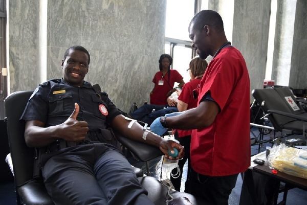 policeman donating blood