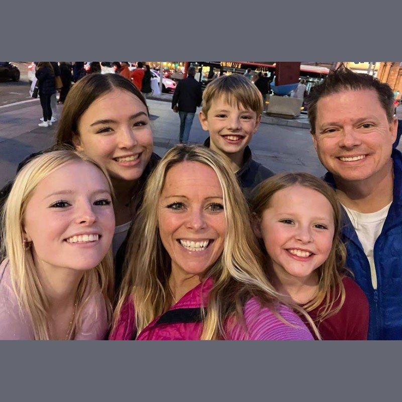 Tricia Friddel taking a selfie with family.