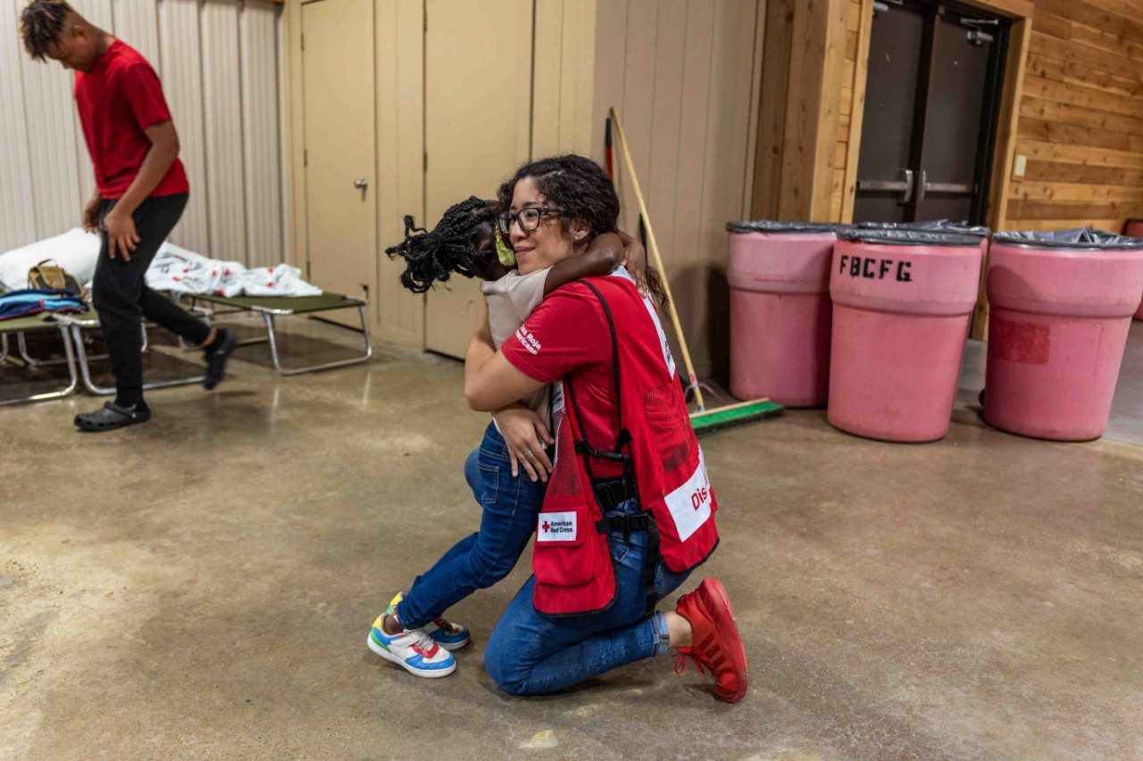 Red Crosser Alexis Gonzalez shared a moment with resident Serenity.
