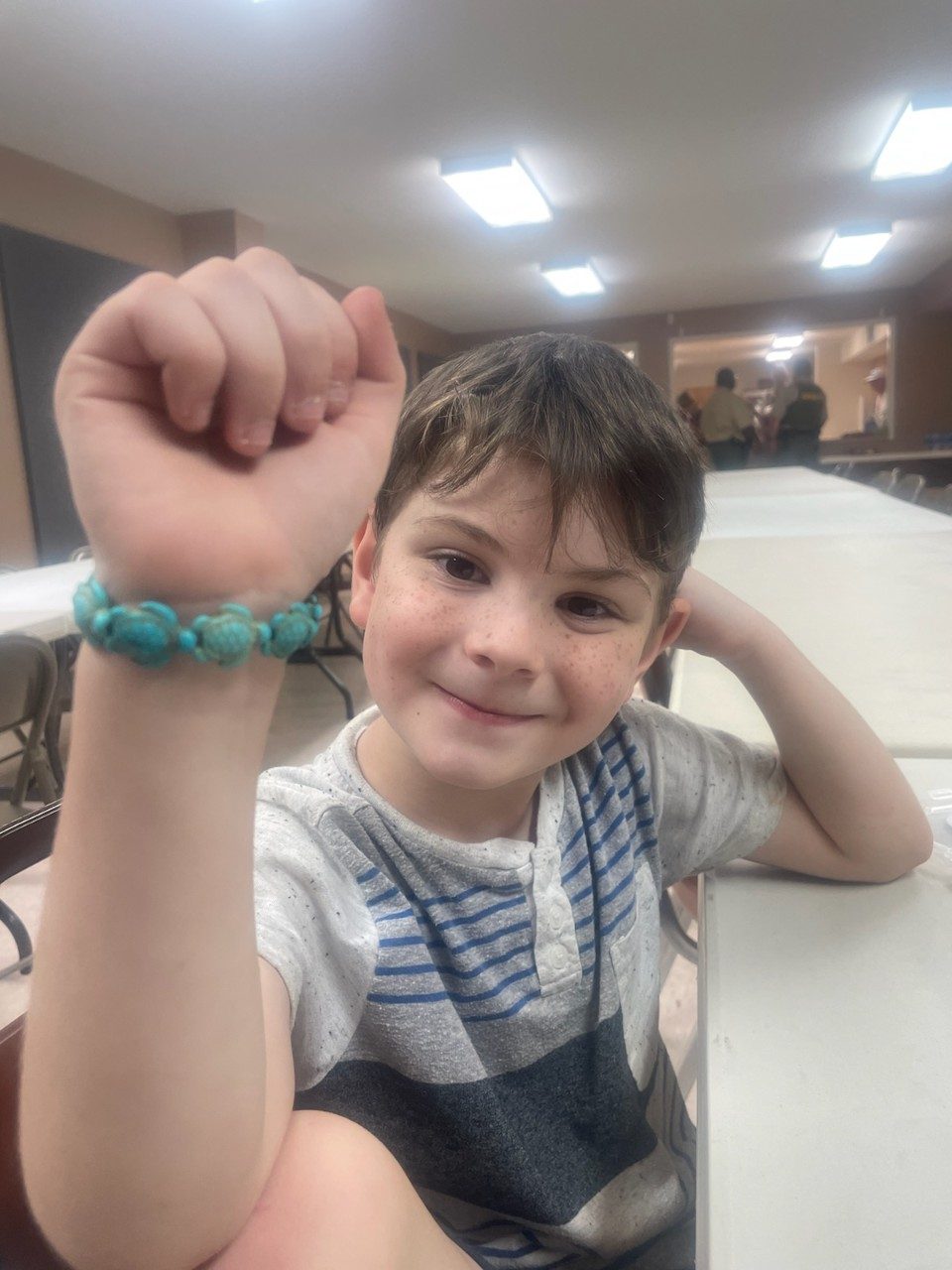 Gunner Brewster shows off his turtle bracelet