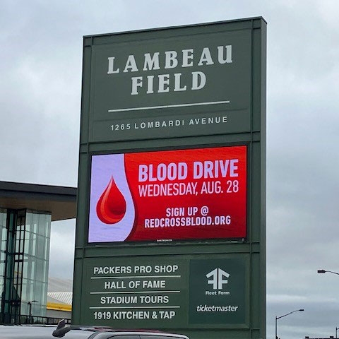 Blood drive advertisement on the Lambeau Field address sign.