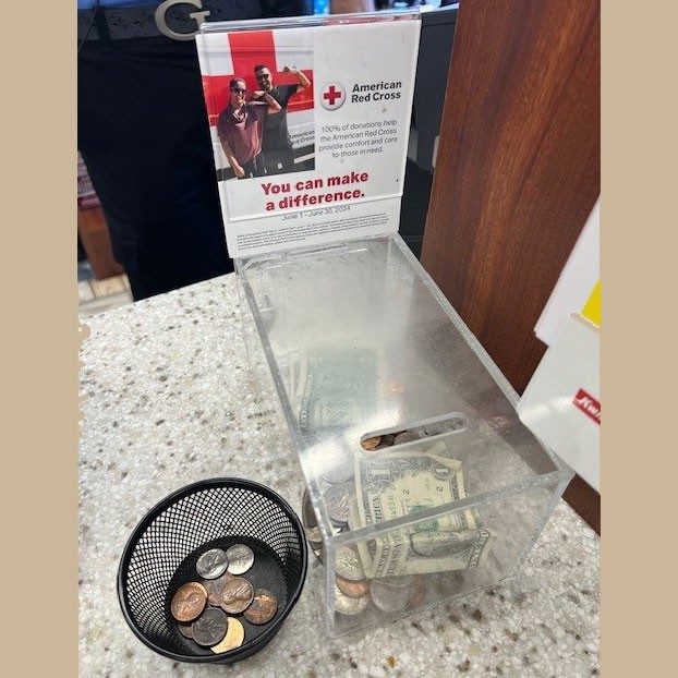 American Red Cross donation box on a counter top.