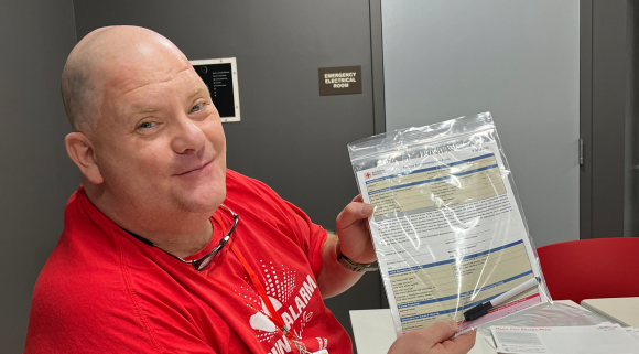 Jim Ward holding paper