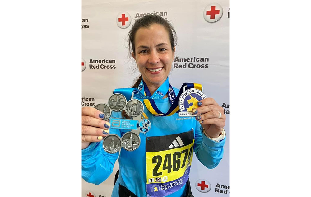 Marathon runner showing medals.