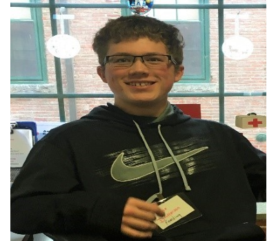 Tycho Dickerson wearing glasses and hoodie.