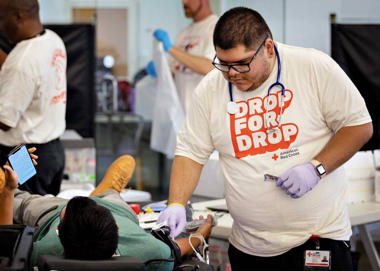 Red Cross nurse taking blood from donor at the Red Cross Drop For Drop Blood Drive