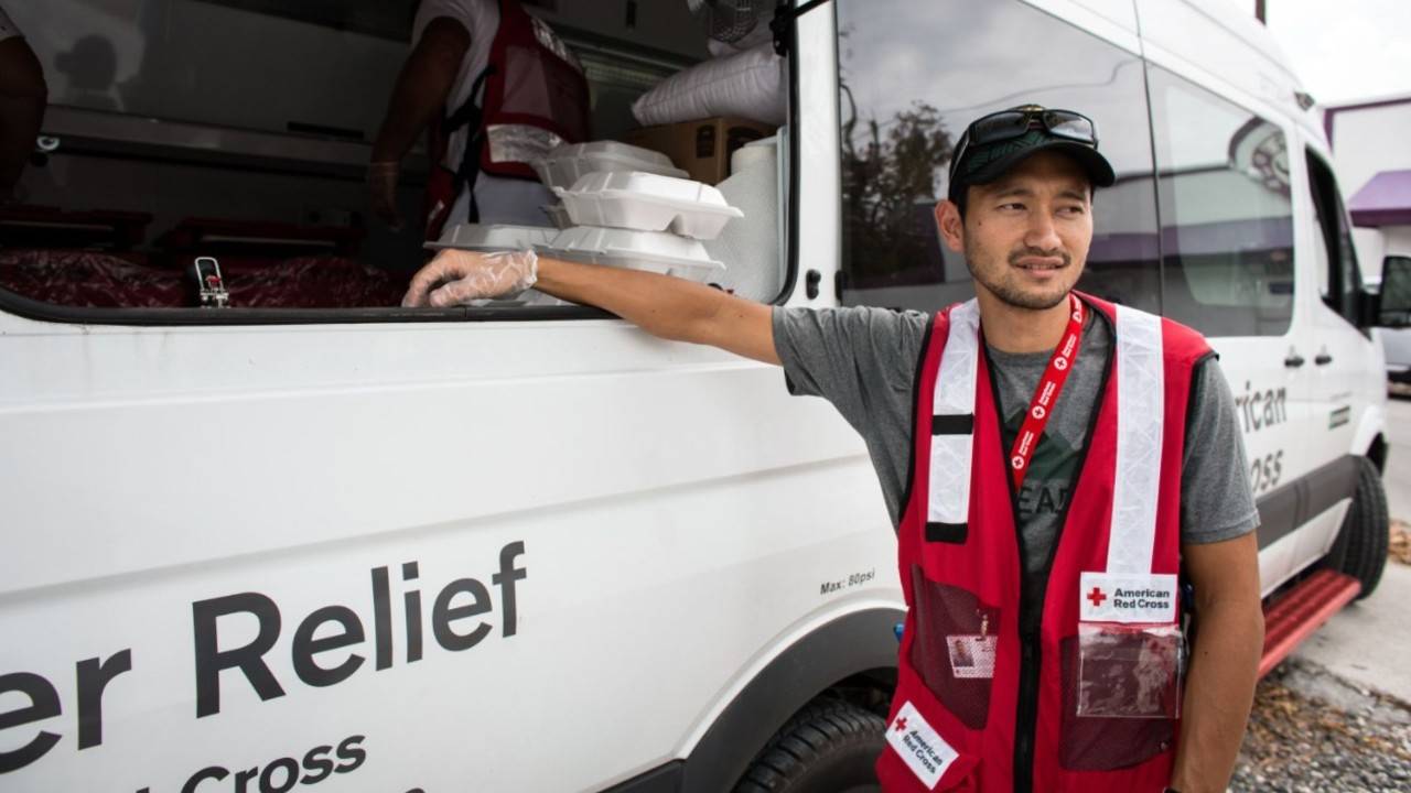 volunteer standing at ERV vehicle