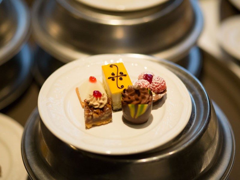 Plate with small gourmet desserts.
