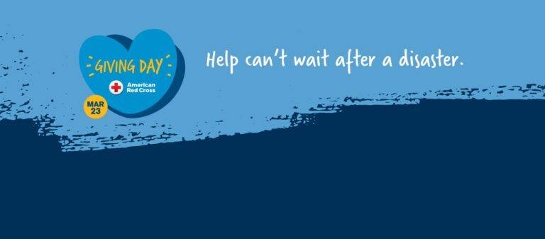 A blue giving day heart on an airbrushed background.