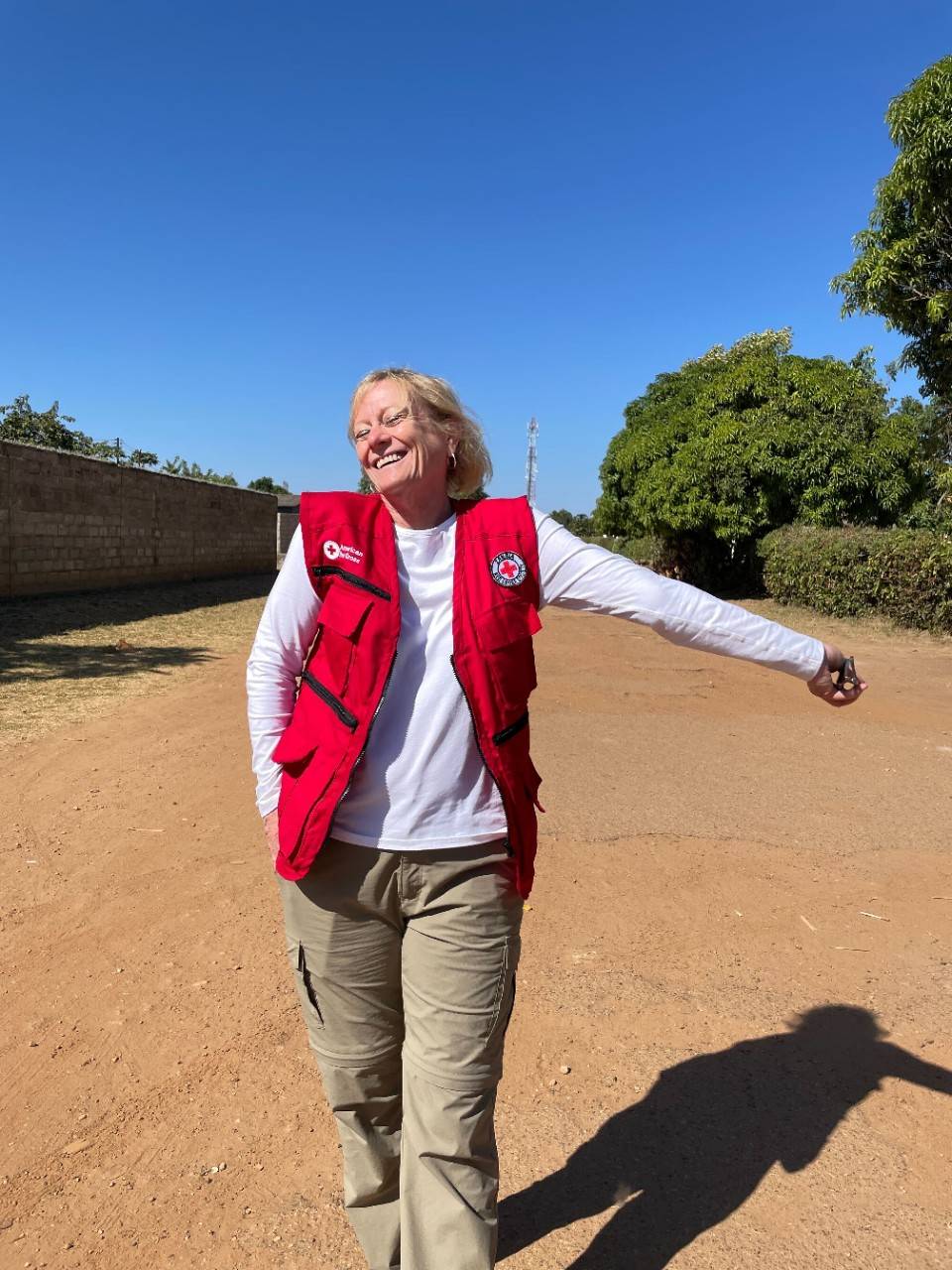 A photo of Kathy Flynn walking along a dirt road
