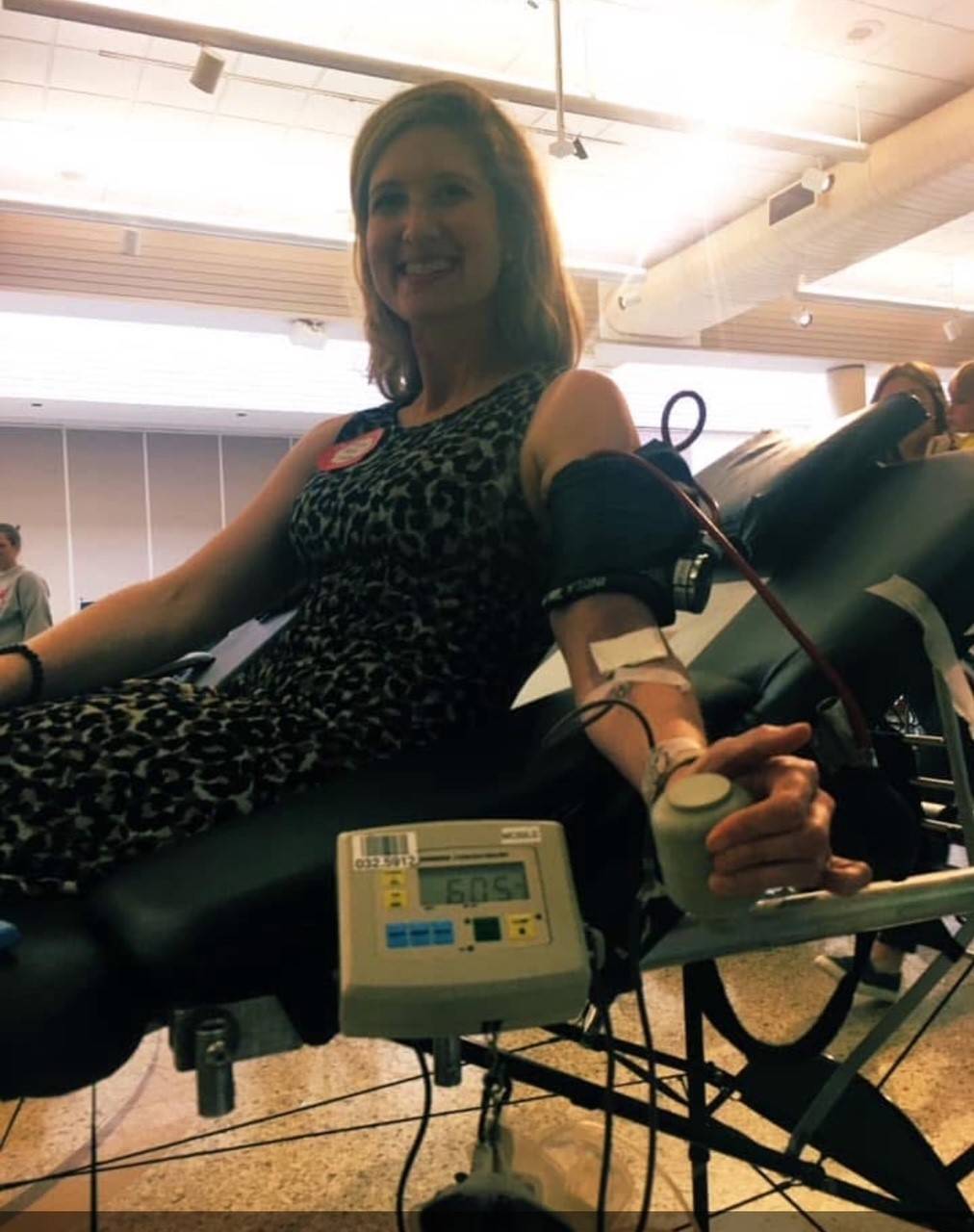 Nicole smiling while donating blood. 
