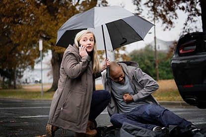 woman with man calling for help