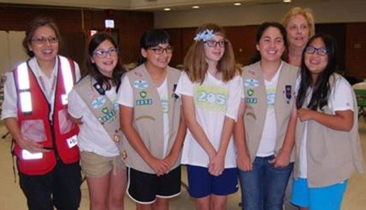 group of happy female youth volunteers