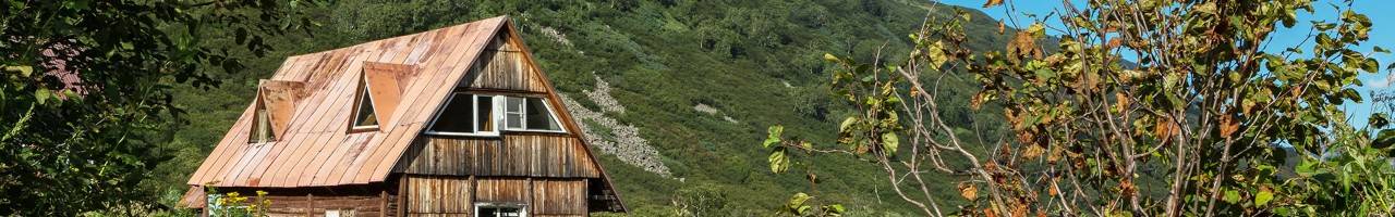 house at foot of volcano