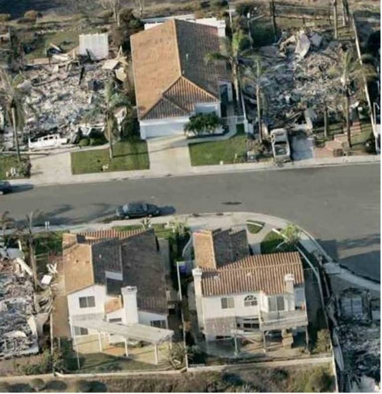 A neighborhood partially destroyed by wildfire