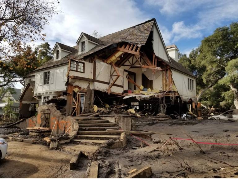 A home with major damage from a wildfire