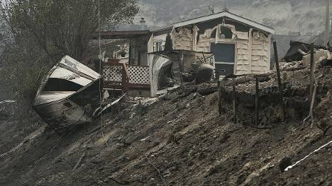 A mobile home with minor wildfire damage