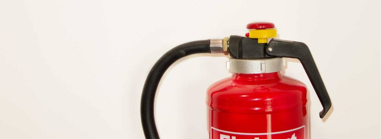 Close-up of a fire extinguisher on wall