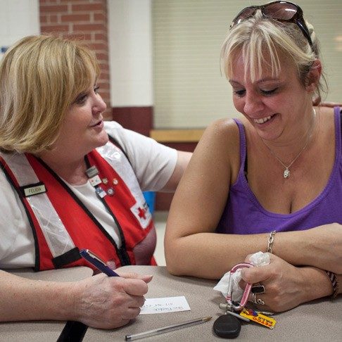 Volunteer comforts a fire victim